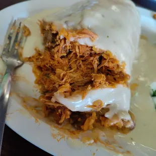 Steak and shredded chicken chimichanga with white queso. Score: 9 out of 10