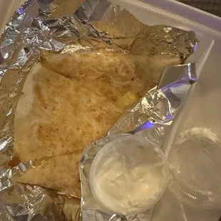 Cheese quesadilla with sour cream