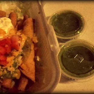 Size comparison between taquitos and typical salsa containers.  They are two containers long.