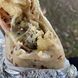 Inside of the breakfast burrito with ham! (Potatoes, eggs, beans, cheese and ham)