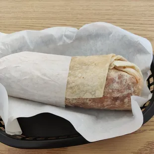 Breakfast burrito, measuring about 9 inches long