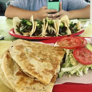 Quesadilla and beef tacos on flour tortillas