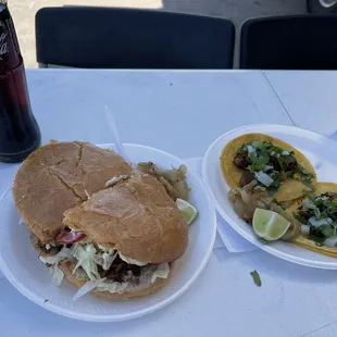 two plates of tacos and a coke