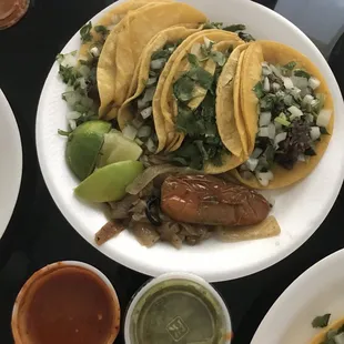 Barbacoa tacos with red and green salsa
