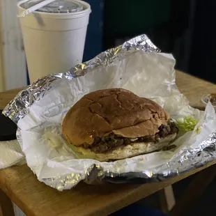 a hamburger and a drink