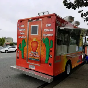 a taqueria truck parked on the side of the road