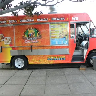 a food truck parked on the side of the road