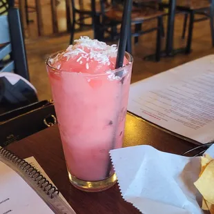a glass of ice cream with a straw