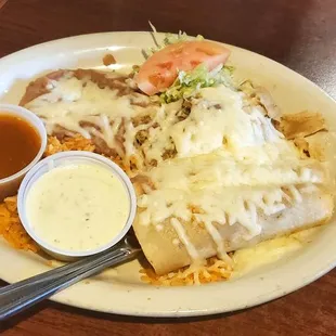 Pick three combo: one chicken tamale, two chicken enchiladas, with rice and beans. Sauces on the side.