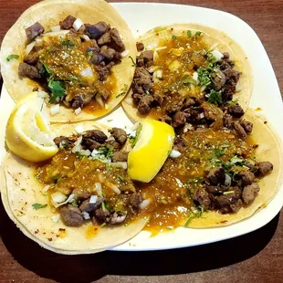 Taco Tuesday!! Choice of meat: beef, chicken, carnitas, or pastor, onions, cilantro, salsa, and lemon wedges.