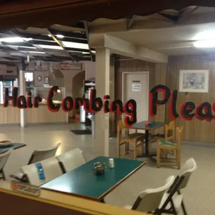 That says "No hair combing please".  ;)