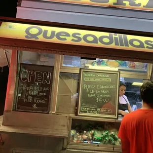 a man ordering quesadillas