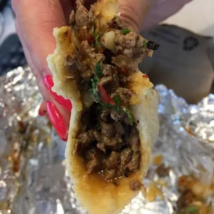 Taco de Carne Asada. $2.25? A single corn tortilla warmed that's a bit larger than the street tacos size.