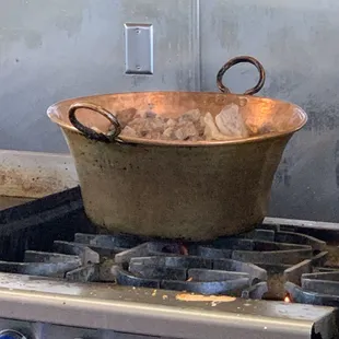 Cooking meat on the stove.