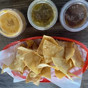 Chips and 3 different types of salsa