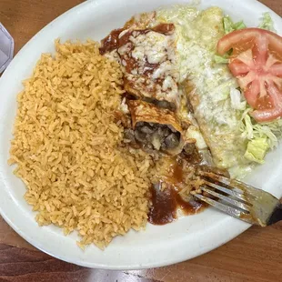 Green and red enchiladas with rice.