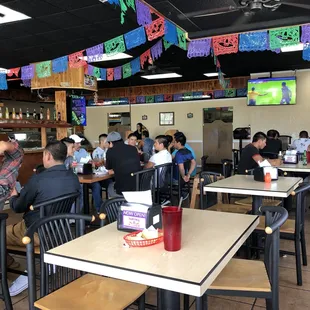 a large group of people sitting at tables