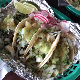 Tacos with asada, al pastor, and carnitas