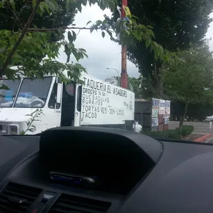 a taqueria truck in a parking lot