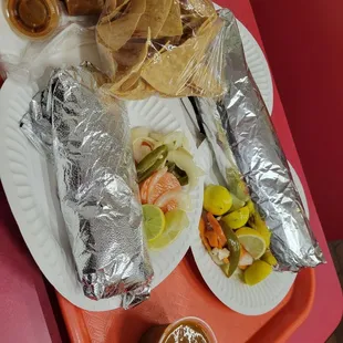 a tray of tacos and chips