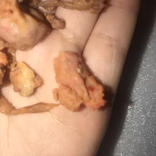 a person holding a piece of food