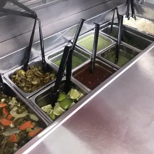 I love how customers can grab toppings and sauces to go. It makes it less of a hassle to ask workers. The sauces are bold.