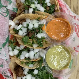 Carne asada, carnitas, tripas y al pastor tacos.