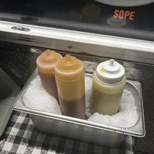 Sauces. The red sauce is the hottest