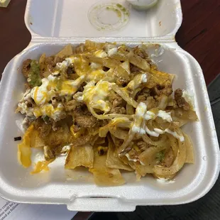 Nachos; home made chips, pork, onions, sour cream and cheese. So so good.