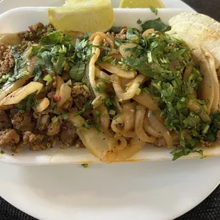 Asada tacos w/ cilantro and onions. Yummy