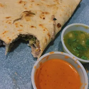 Half of a veggie tlayuda and the salsas are the best!!