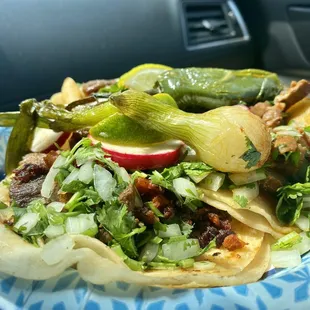 Three tacos with all of the fixings. Today I chose lengua, carne enchilada, and cueritos.