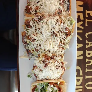 Hay Oaxaca with Al Pastor. Top to bottom: huaracha, sope, taco