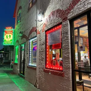 a neon sign on the side of a building