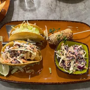 Fish and beef taco with slaw and street corn.
