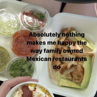 Chicken taco on corn tortilla with added avocado and all of their house made salsas + pico and cilantro