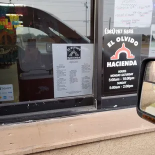 a reflection of a car in the window