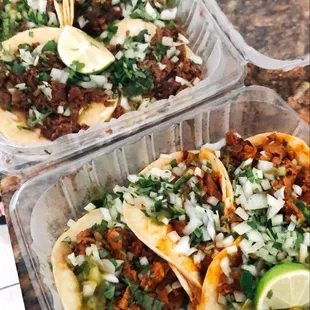 three tacos in plastic containers