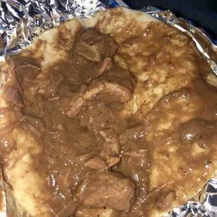 Carne guisada taco with 4 little pieces of meat.