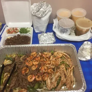 Our first GrubHub order from 2 weeks ago... so yummy and packaged well! Parrillada El Charro in big tray &amp; Barbacoa in styrofoam container.