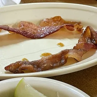 Strips of bacon  Crispy. Edible.