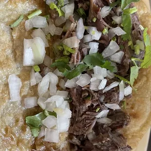 Barbacoa taco on corn tortillas.  I don't like it greasy, so to me three out of four stars. The corn tortilla was soft and good.