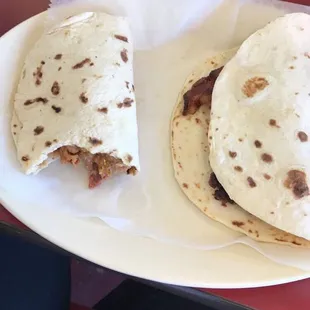 Beans and bacon breakfast taco in flour tortillas.