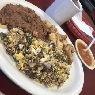 Machacado plate with coffee and salsa ranchera on the side.