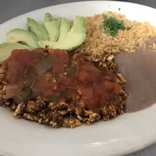 Special Made Breakfast Plate- Huevo Con Chorizo with salsa ranchera; rice,beans and avocado on the side