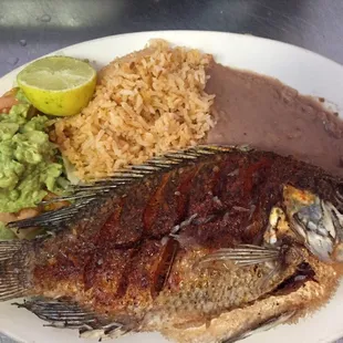 Plate #18- Plato de Mojarra/ Fish Plate. Side order of lettuce, tomato, guacamole, rice and beans