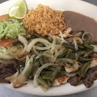 Plate #15- Fajita de pollo with Fajita, grilled nopales and cebolla. Comes with lettuce, tomato, guacamole, rice and beans on the side