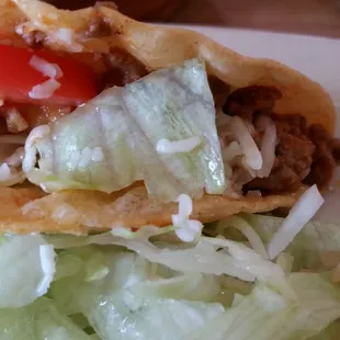 closeup on the crispy picadillo taco (after I shoved some salad in..)