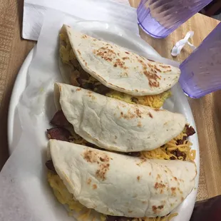 Chicharron, egg and cheese &amp; egg and country sausage breakfast tacos! They were so big we had to take one to go!