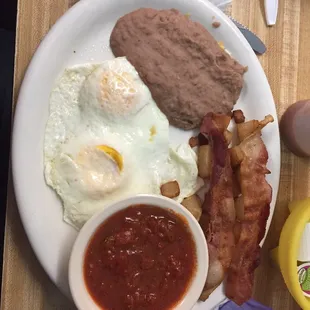 Huevos Rancheros with the eggs well done and ranchero sauce on the side.  You can request your eggs to your desired preference.
